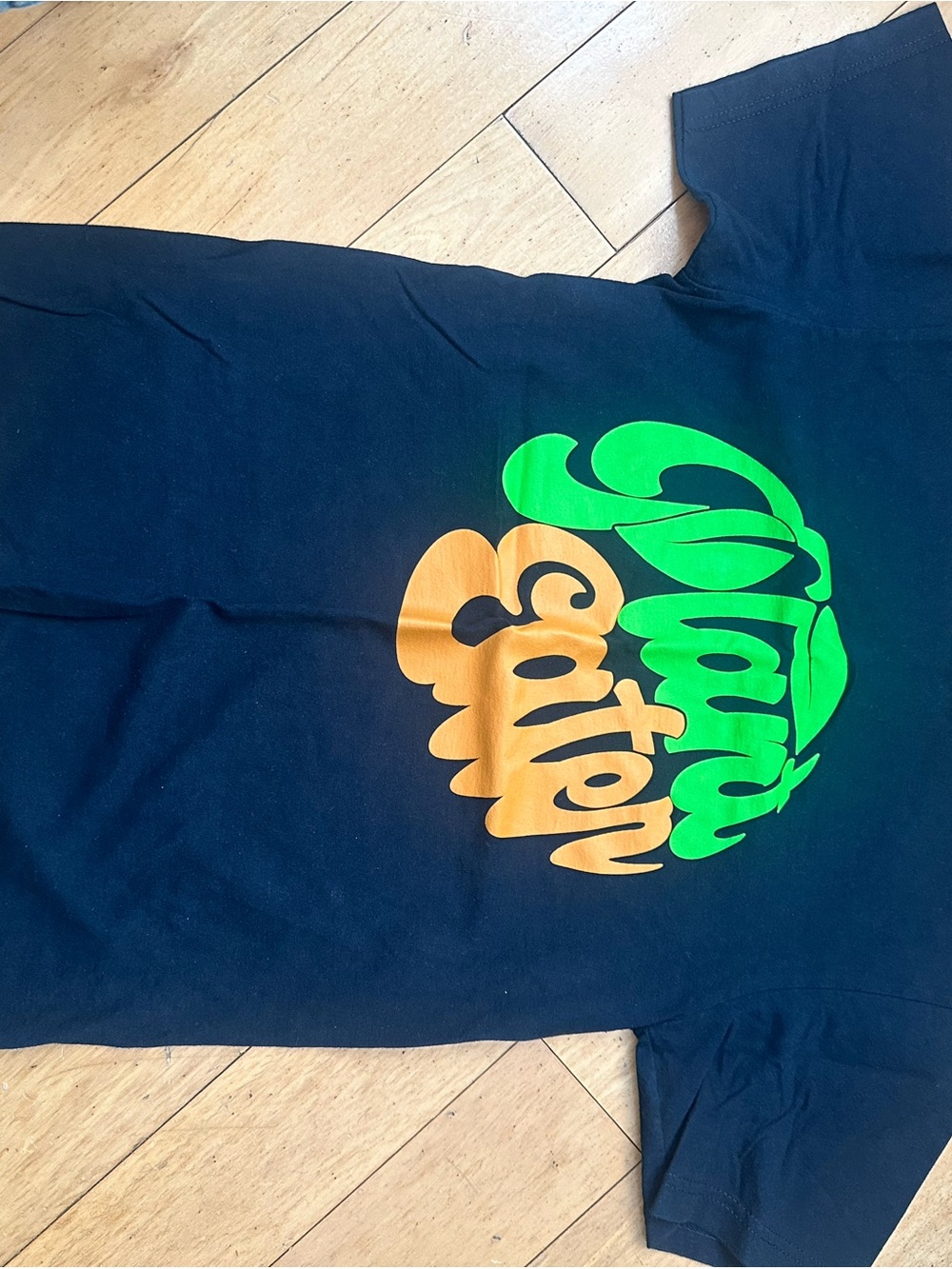Black Graphic Tee with Bright Green and Orange 'Plant Cotton' Print